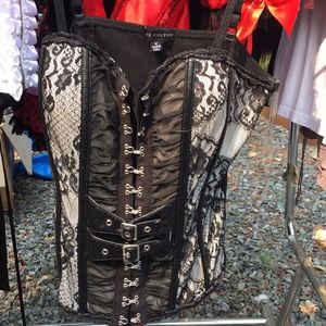 Buckles and lace corset top. M.
